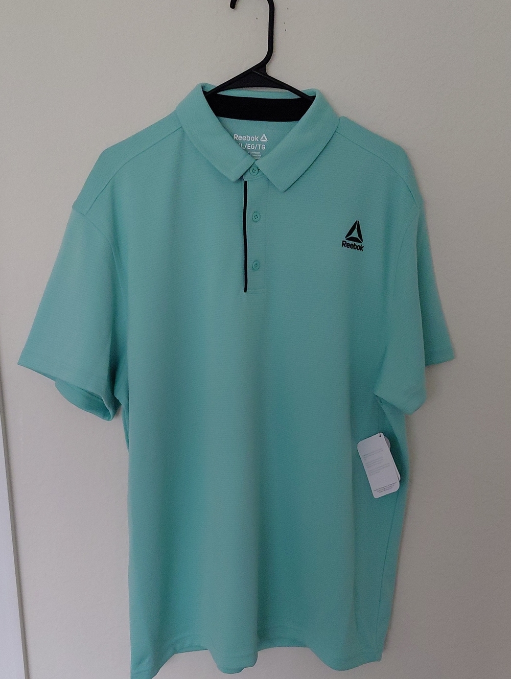 Reebok Men's Performance Polo Shirt.